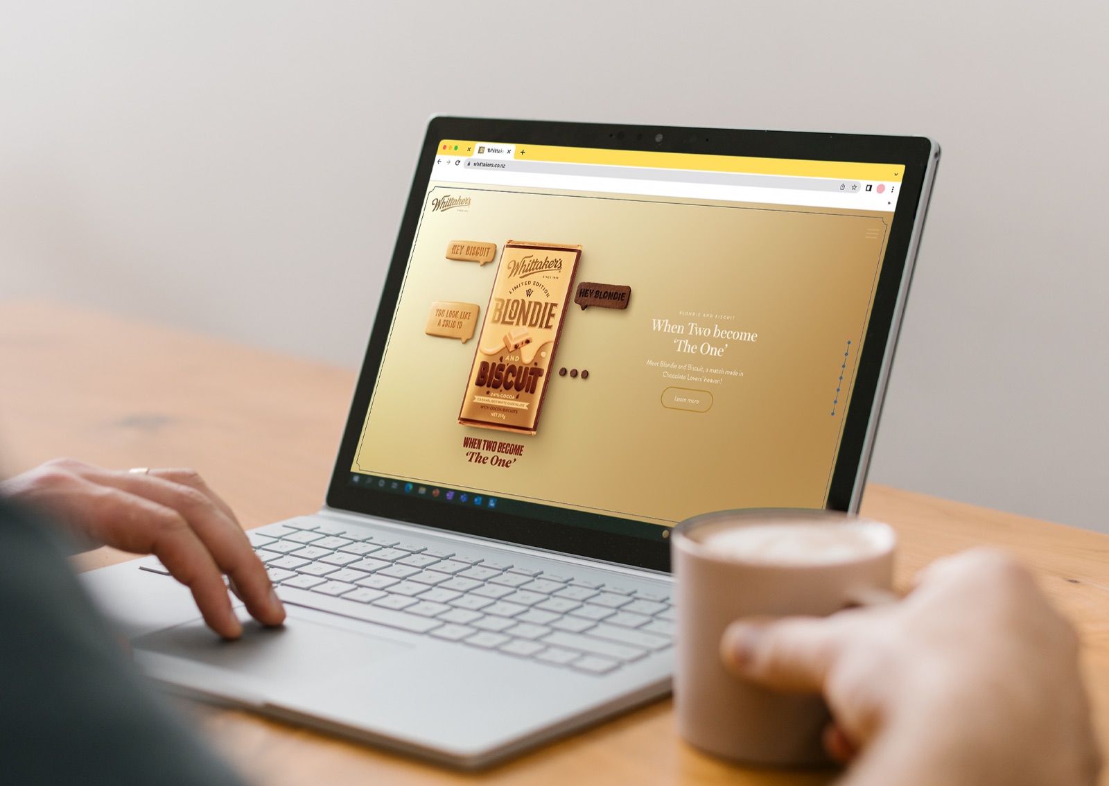 Laptop showing the Whittaker's website featuring the Blondie and Biscuit product launch page