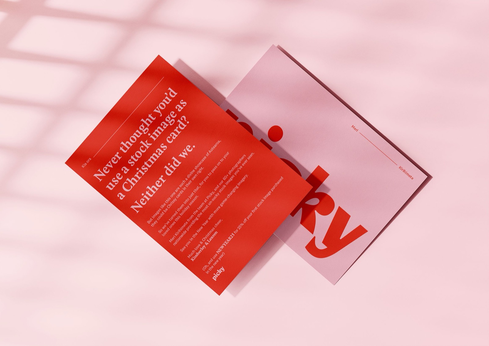 Picky Christmas card mockup reading "Never thought you'd use a stock image as a Christmas card? Neither did we" beside a pink Picky branded envelope