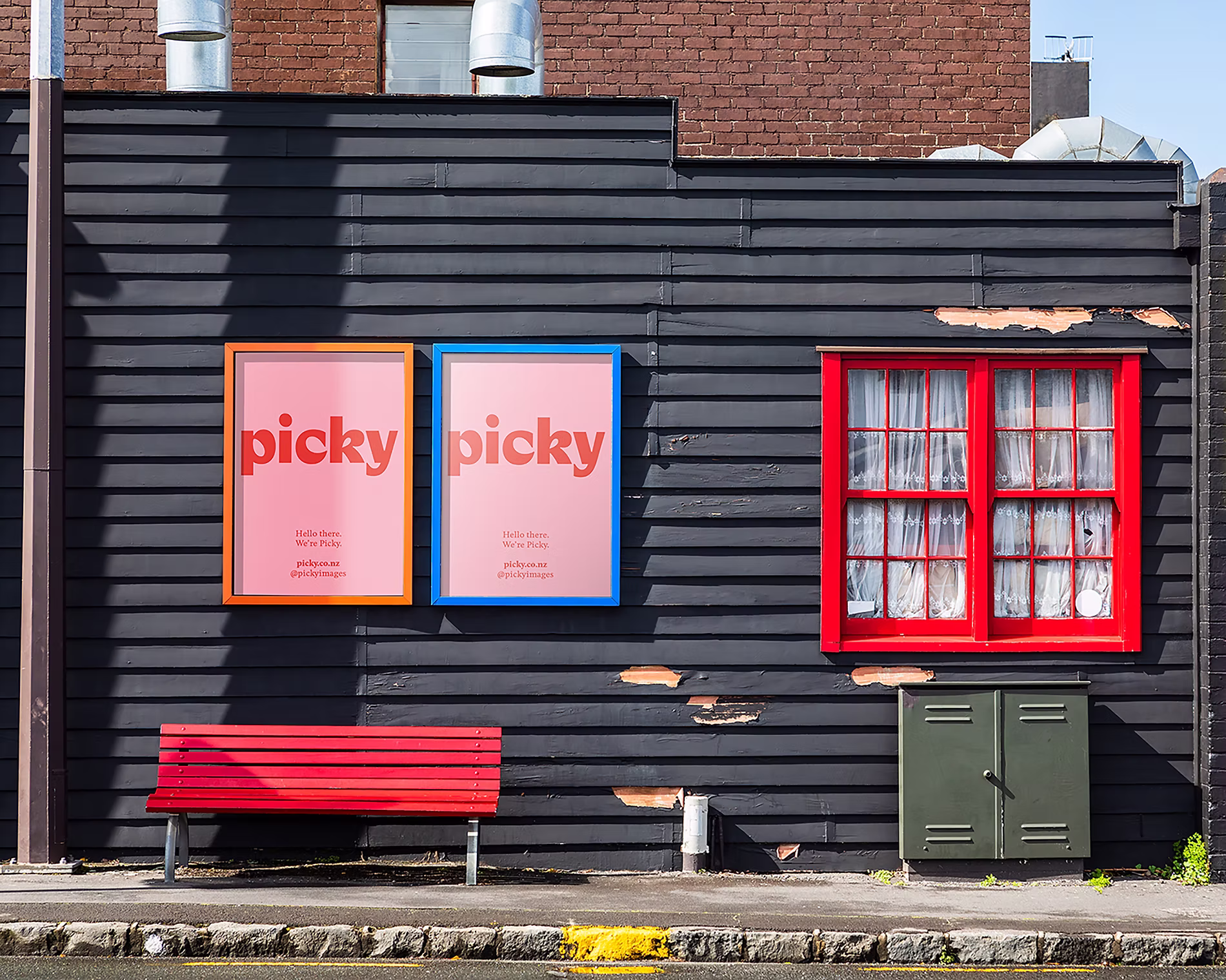 Two Picky poster mockups reading "Hello there. We're Picky." displayed on a dark weatherboard wall