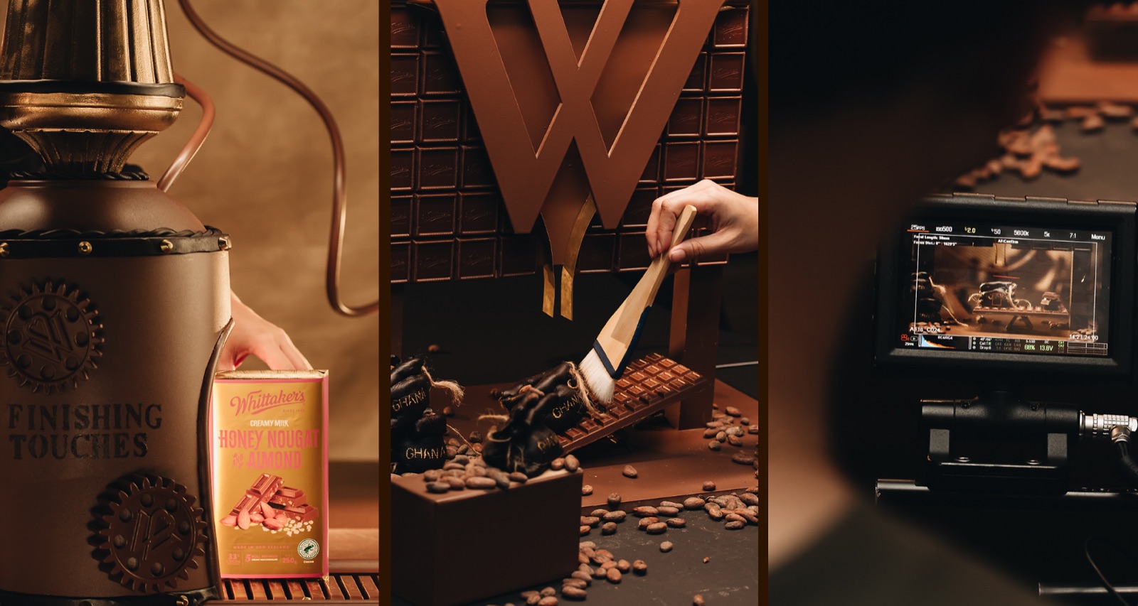 Three behind-the-scenes shots of a Whittaker's chocolate shoot — finishing touches on a product, cocoa beans brushed onto chocolate, and a camera monitor
